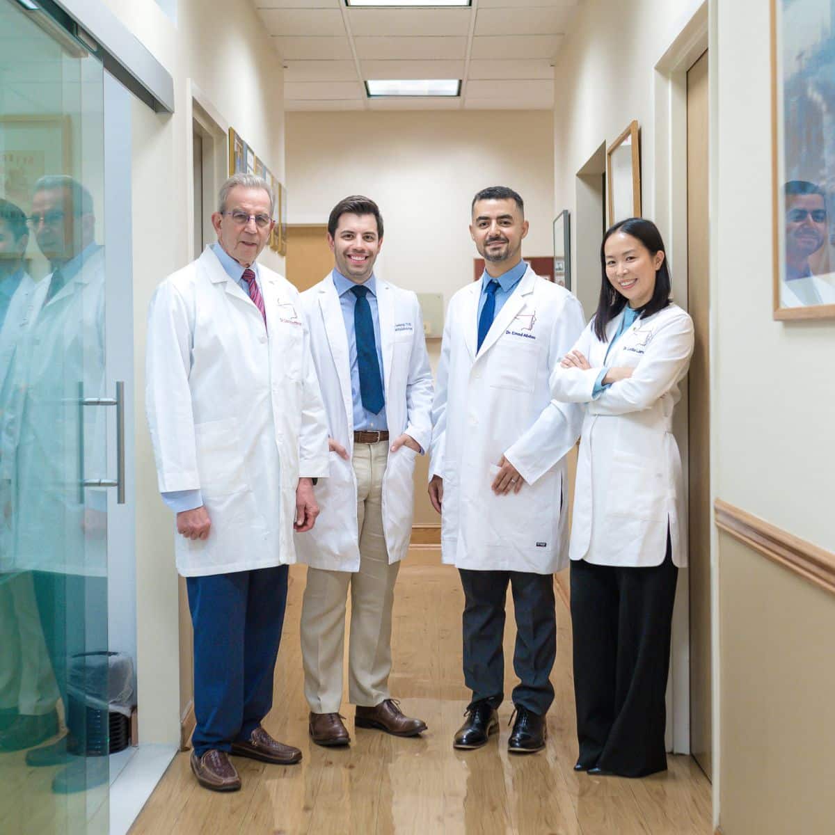 Dentists smiling from Staten Island Oral and Maxillofacial Surgery
